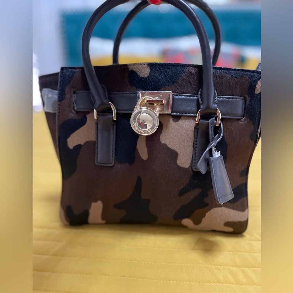 Michael Kor new without tags multi color cow skin handbag.